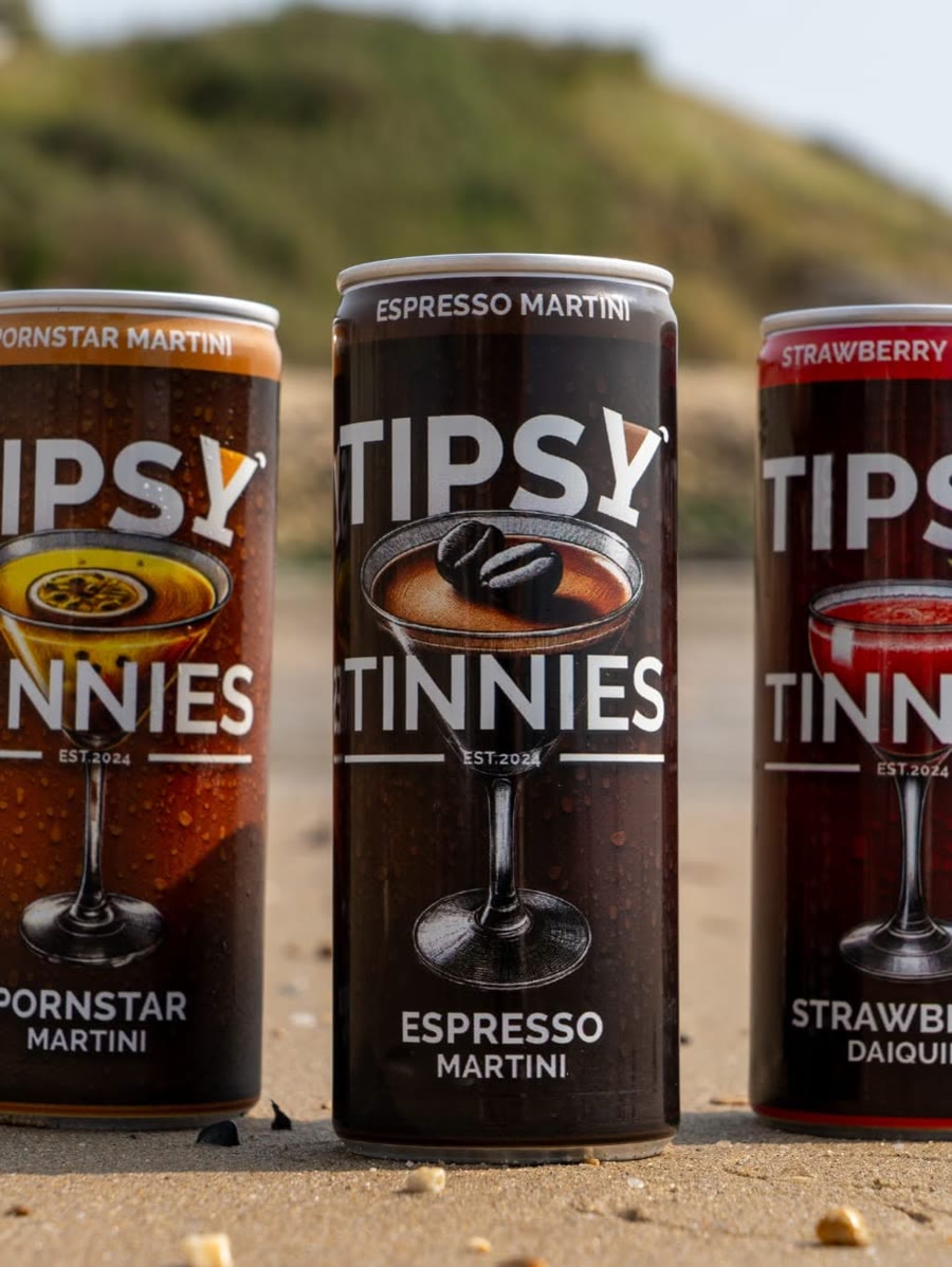 Espresso Martini tin between the Pornstar Martini and Strawberry Daiquiri on the beach