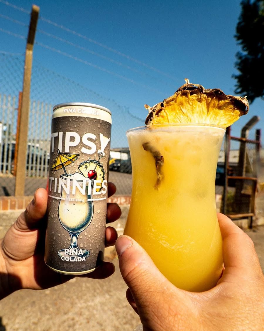 Piña Colada held up outdoors with a pineapple wedge